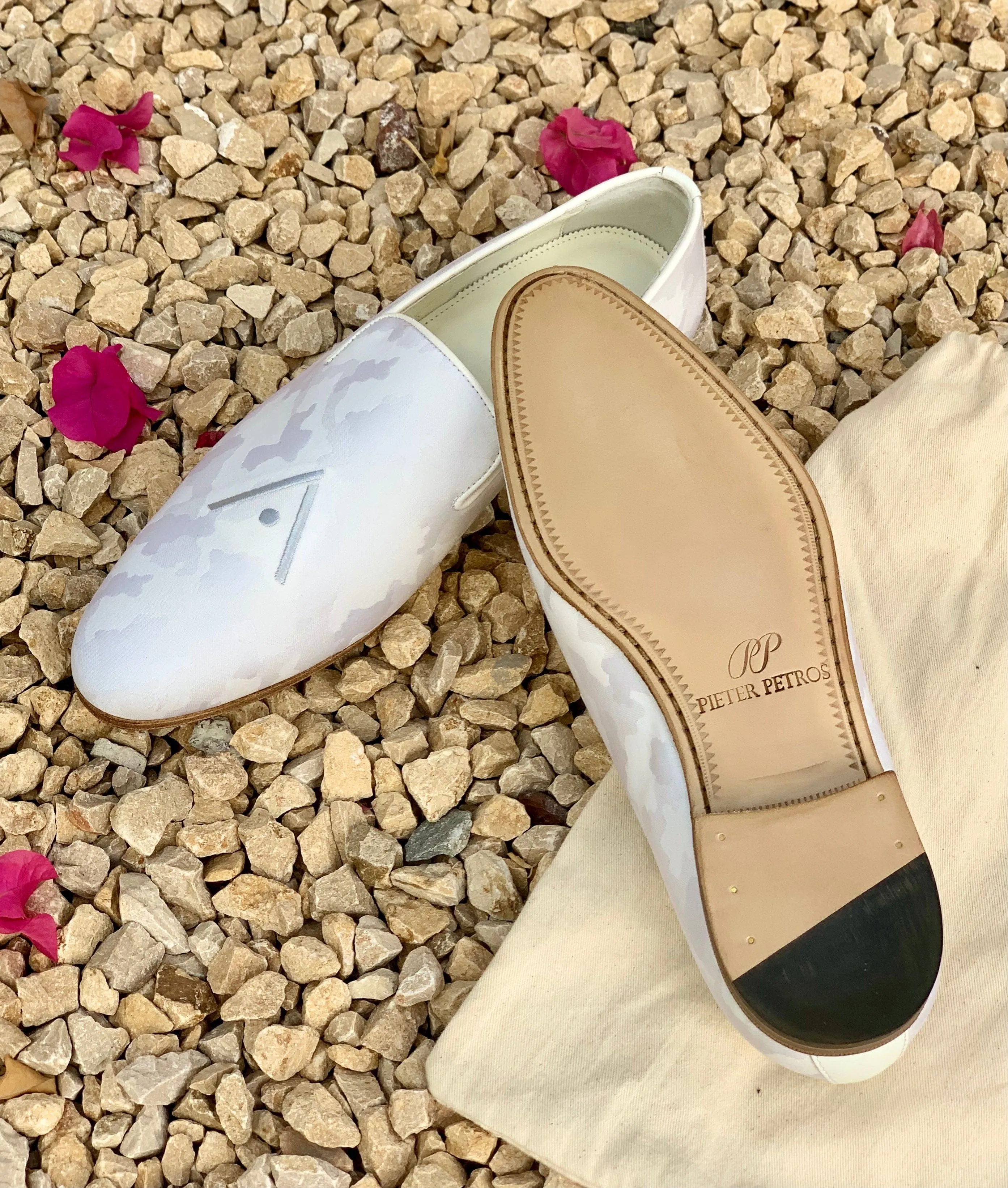 Certainly! To optimize the title for an e-commerce product, we can include important keywords and descriptive modifiers to make it more appealing and searchable. Heres a suggestion:

Luxurious Handmade Bespoke Leather Shoes by PIETER PETROS® - Customizable Designer Footwear